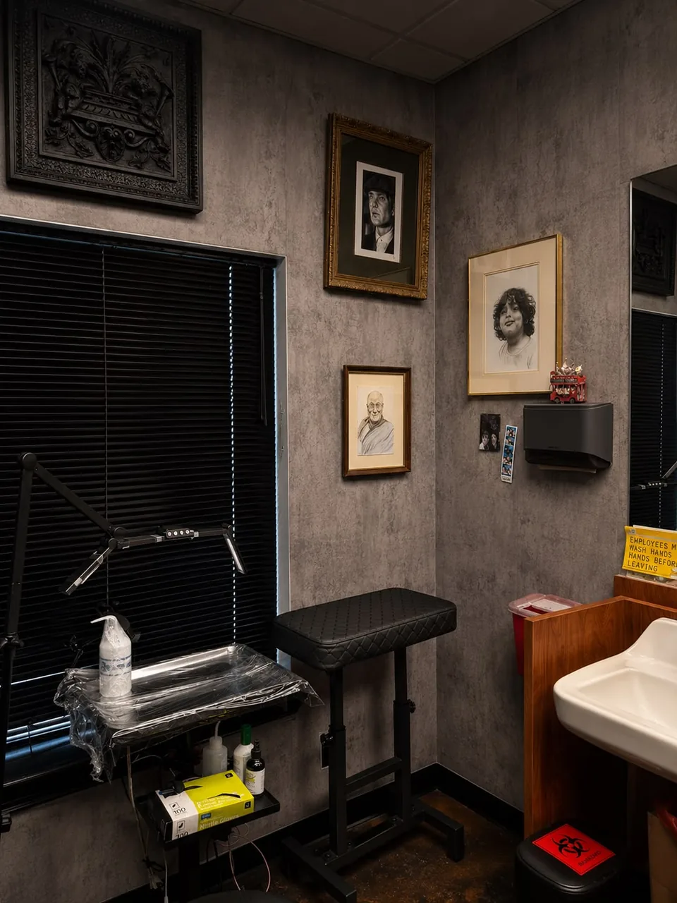 The window side of the studio: a covered tray of equipment, gloves, the armrest and the sink.