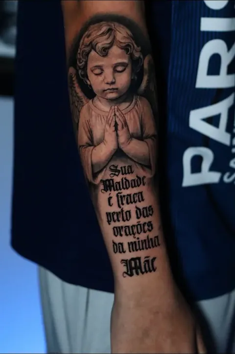 Cherub & script — Statuary and lettering.